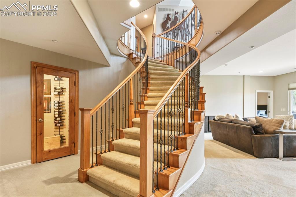 Image 29 of 39: Stairs featuring carpet floors