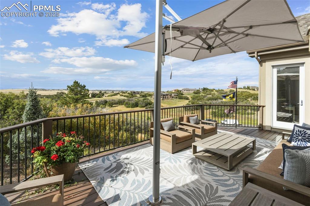 Image 33 of 39: Deck featuring an outdoor hangout area