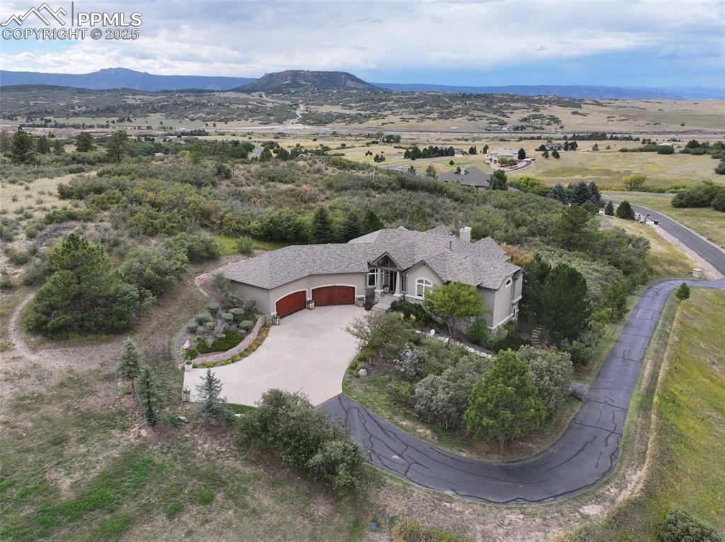 Image 36 of 39: View of property location featuring a mountain backdrop
