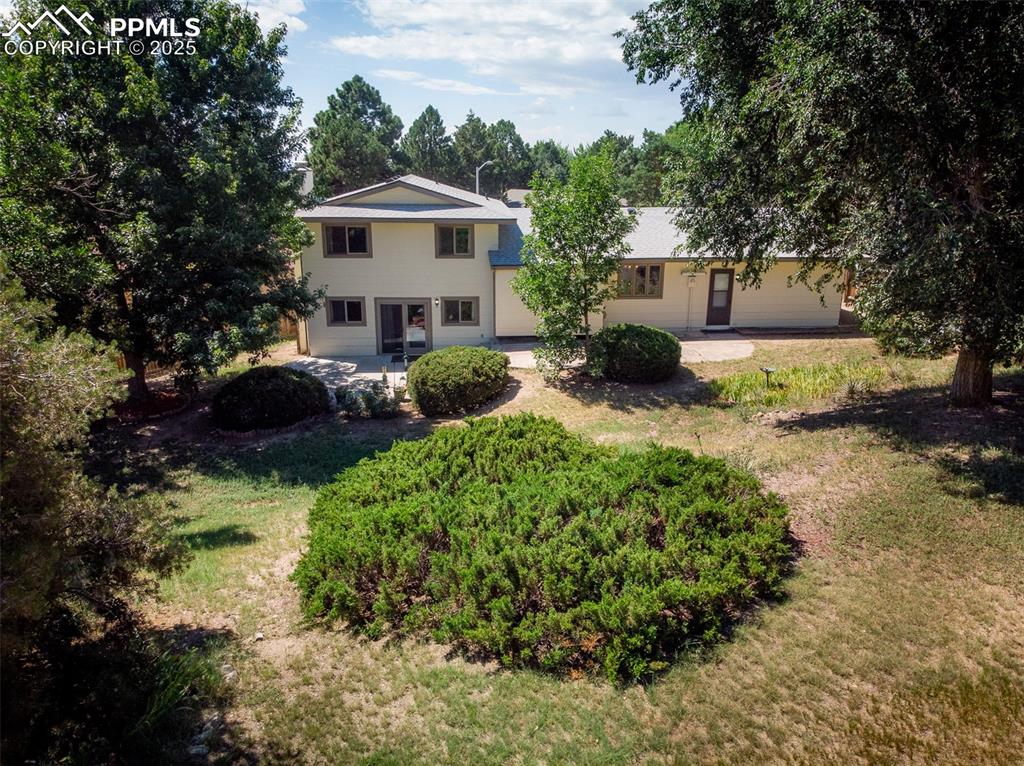 Image 10 of 49: Huge back yard with patio area.