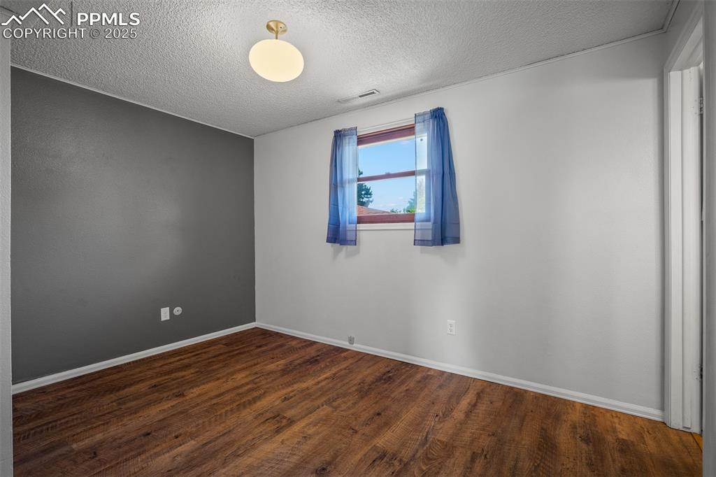 Image 34 of 49: Upstairs bedroom with full bath