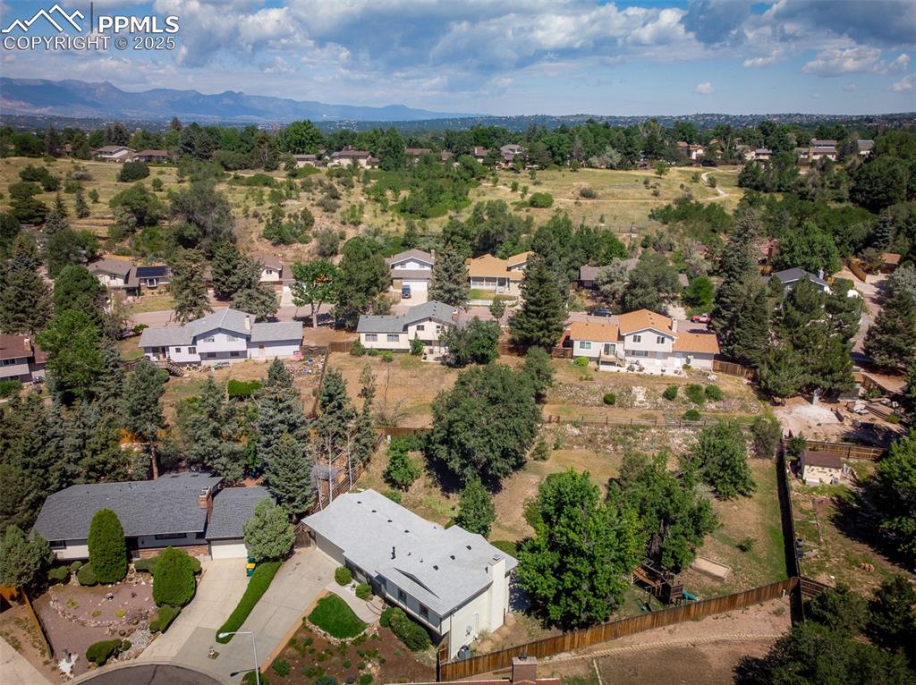 Image 4 of 49: Aerial perspective of back yard area featuring property parcel outlined and
