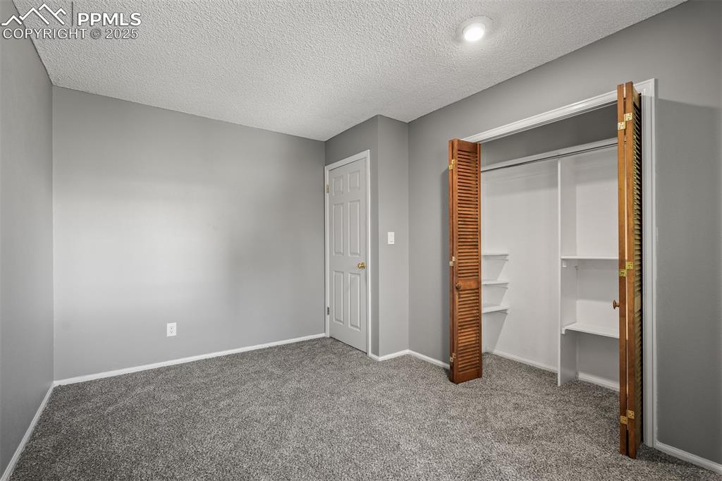 Image 42 of 49: Third Upstairs bedroom with new carpet.
