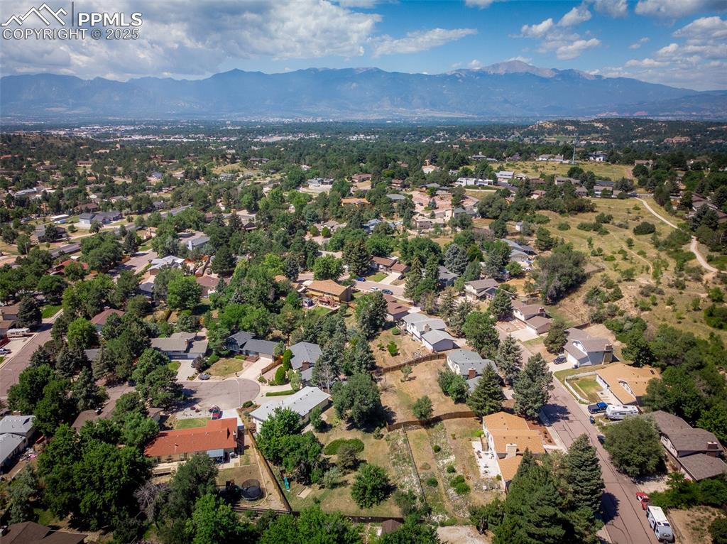 Image 6 of 49: Aerial view of area with a mountainous background. Approximate boundary li