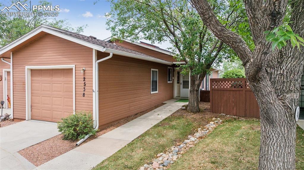 Caption: Maintenance-free landscaping leading up to your front door