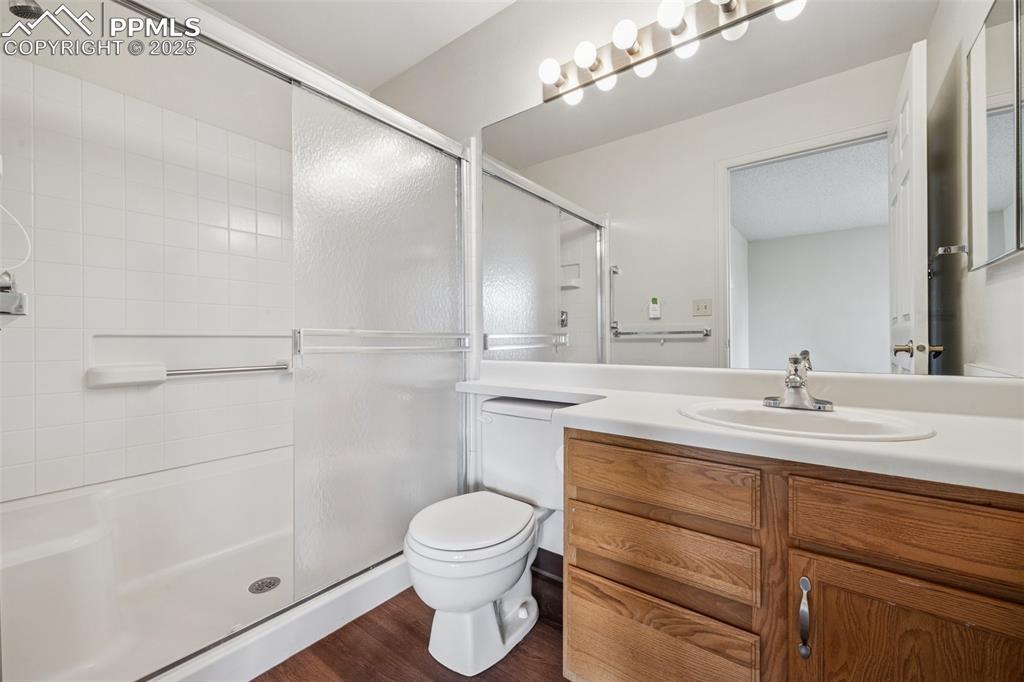 Image 14 of 27: The primary bathroom features a free-standing shower and upgraded LVP floor