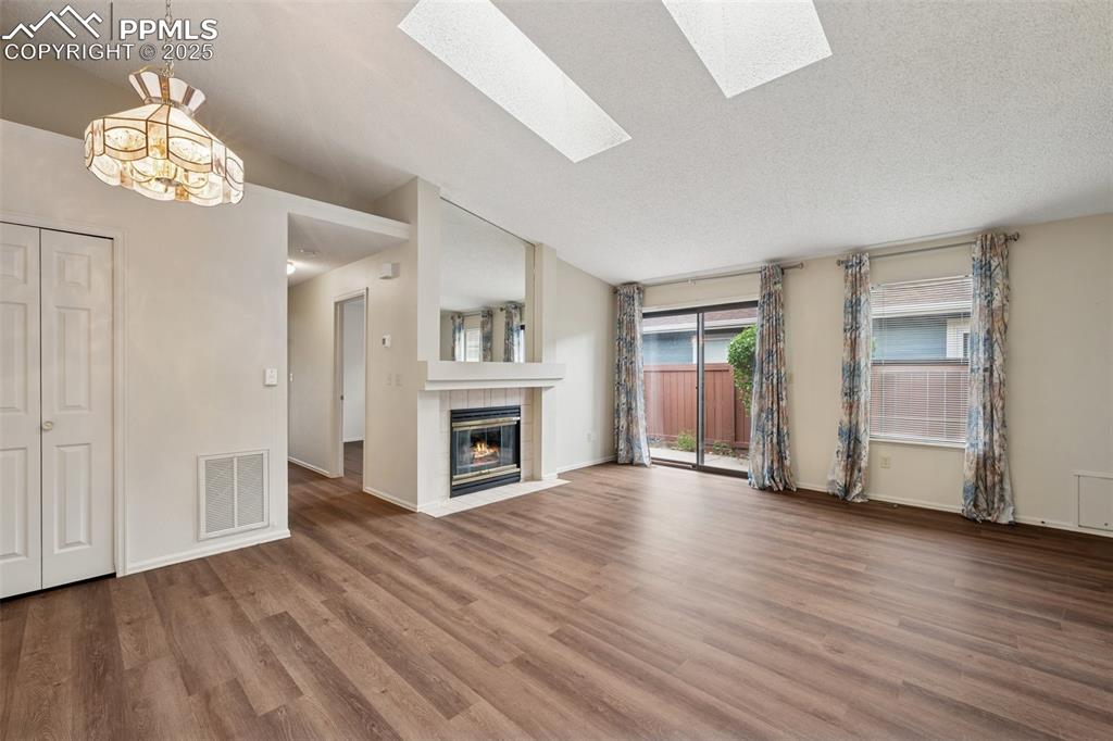 Image 7 of 27: New LVP flooring throughout the entire townhome