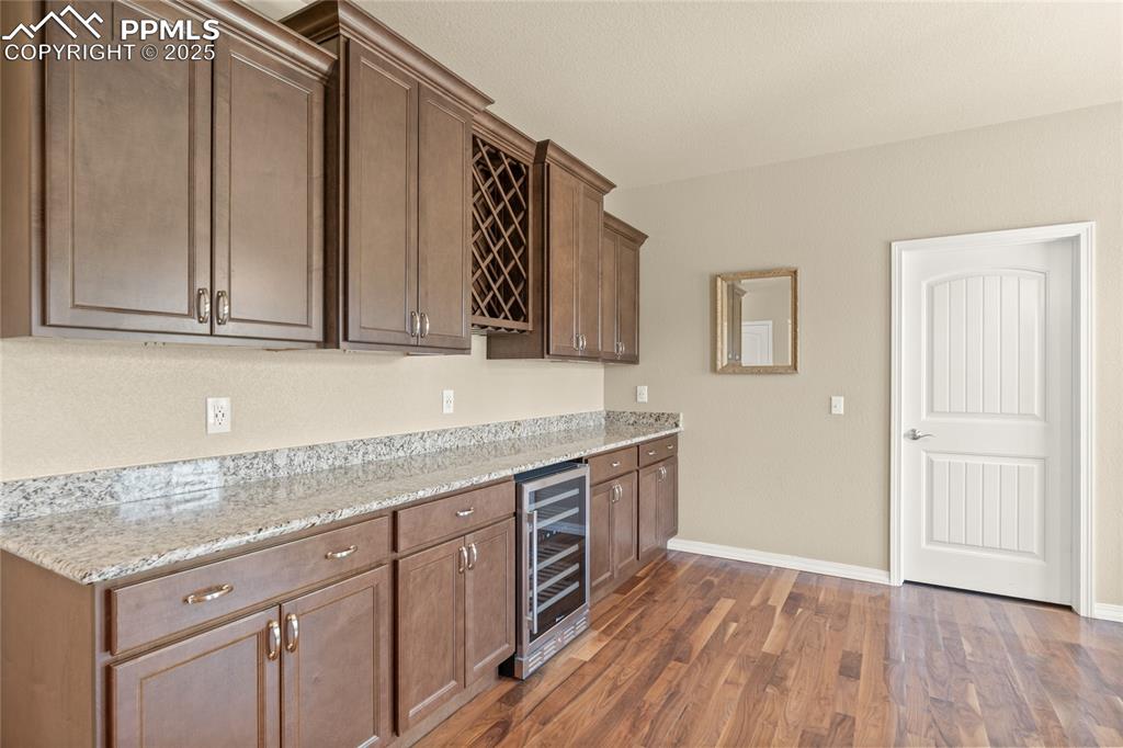 Image 18 of 34: Imagine entertaining here! Plenty of food prep space, a cooler, and wine s