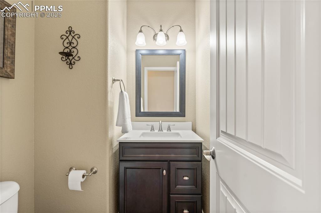 Image 19 of 34: Main level powder room.