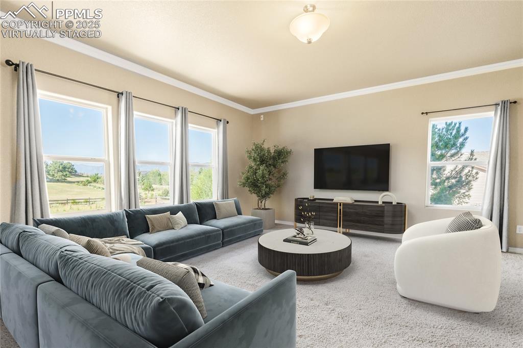 Image 3 of 34: Virtually Staged: The family room shares the fireplace - and has mountain v