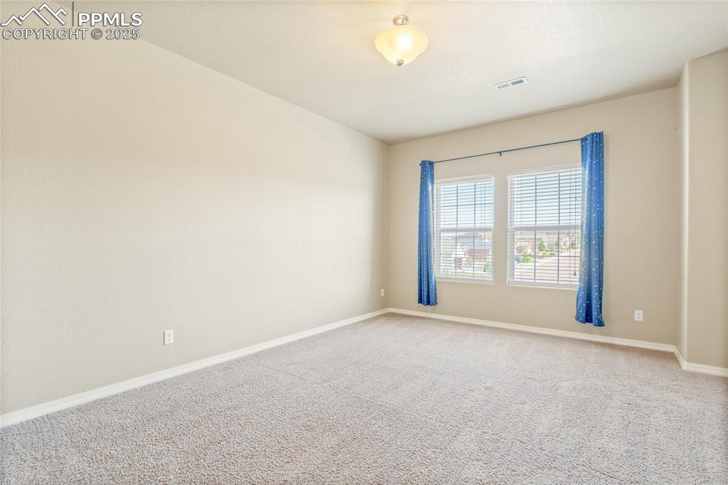 Image 30 of 34: Upper level bedrooms are huge, spacious, and bright.