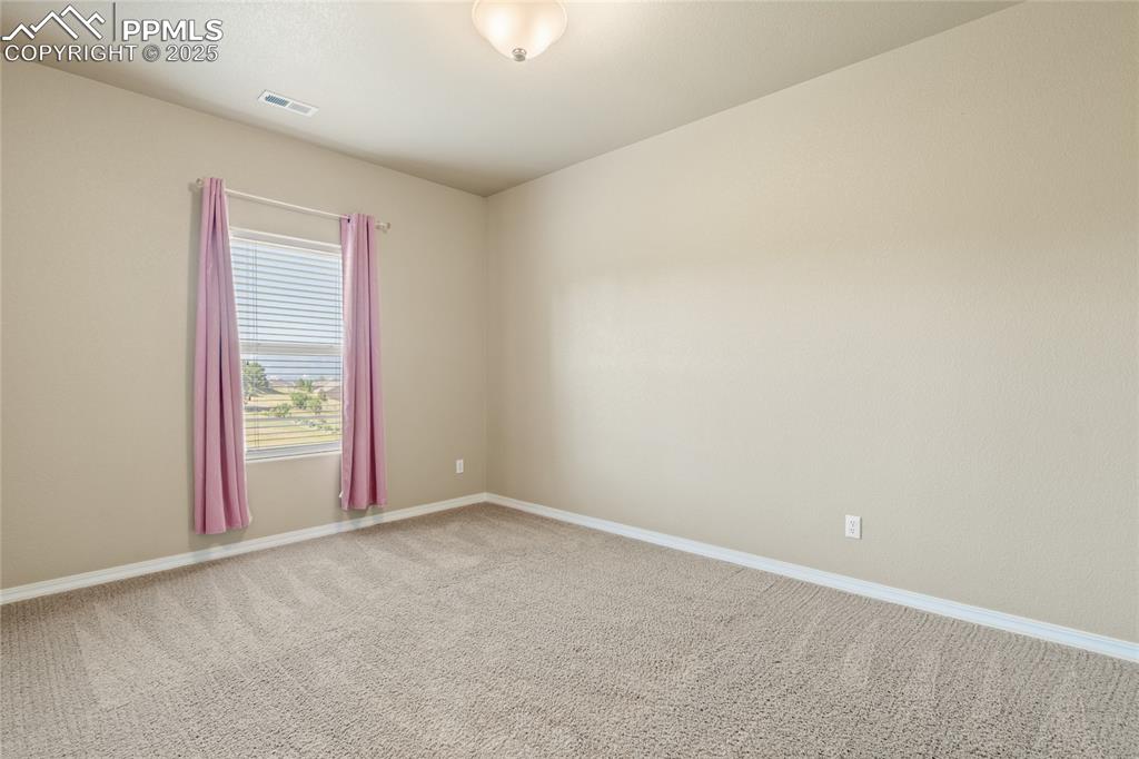 Image 33 of 34: An additional upper level bedroom.