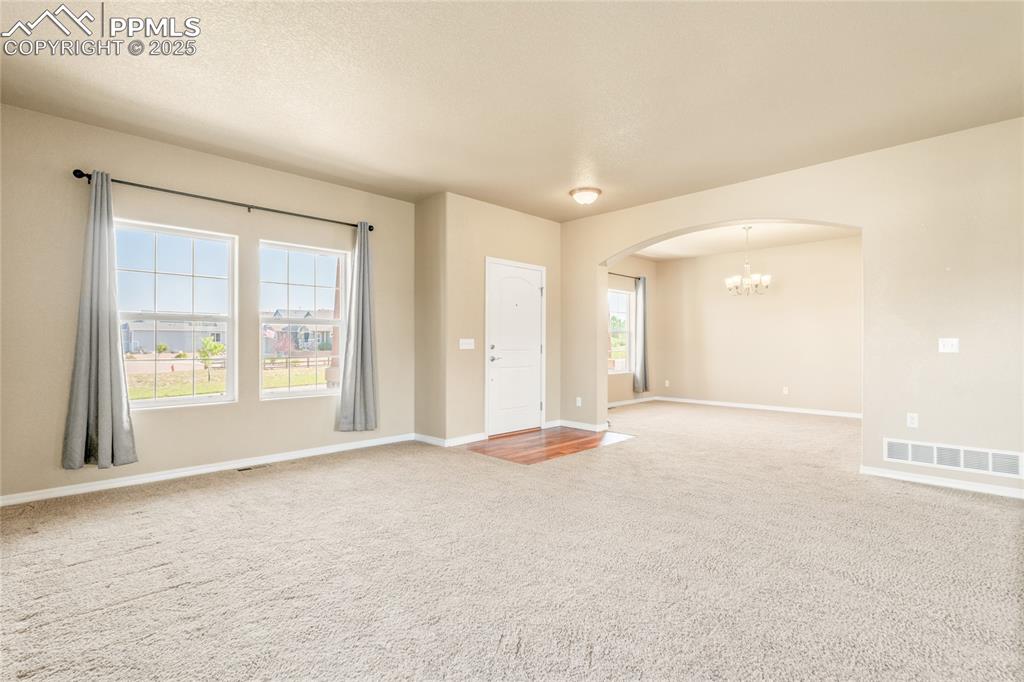 Image 9 of 34: The main level is expansive and bright.