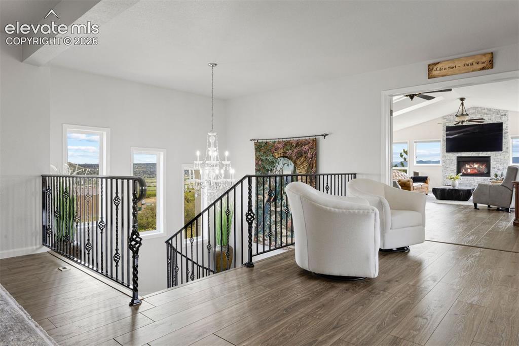 Image 9 of 38: The sprawling patio anchors a backyard complete with a white sand beach sea