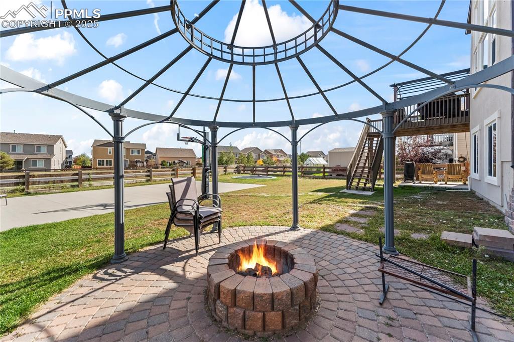 Image 46 of 48: View of patio featuring a residential view and stairs