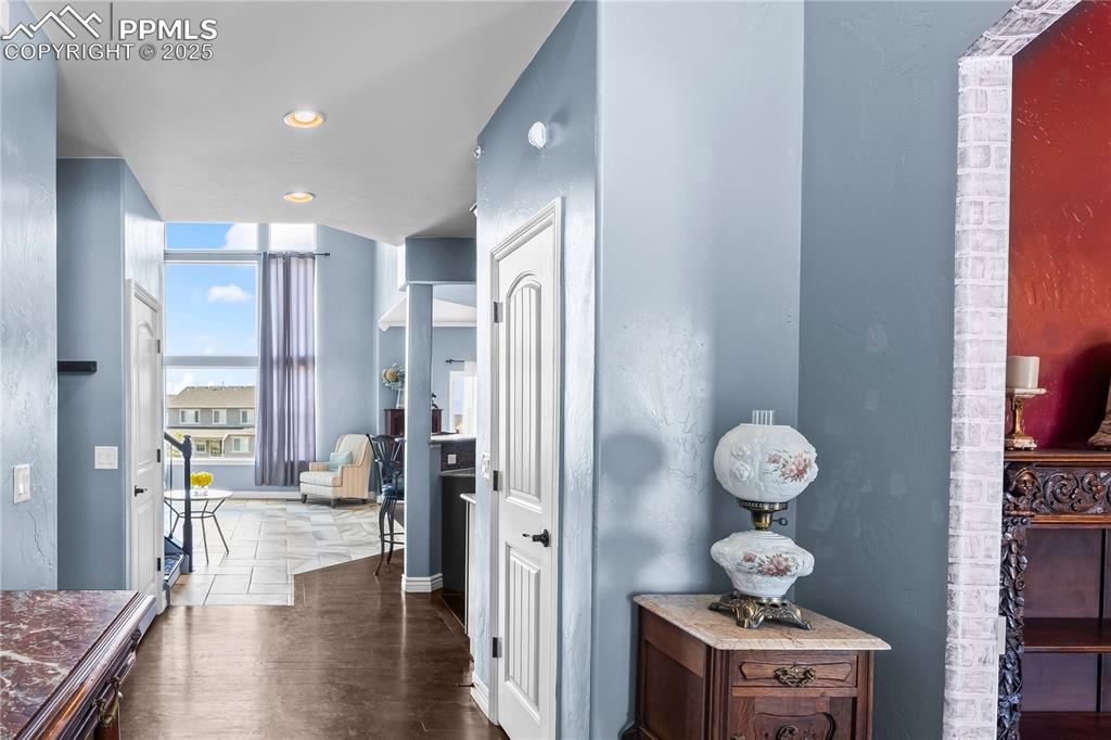Image 6 of 48: Main Level entryway  featuring dark wood-style flooring, recessed lighting,