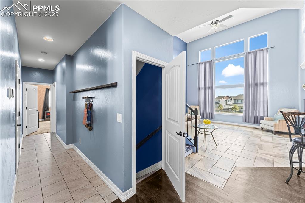 Image 9 of 48: Main Level Hallway with baseboards and light tile patterned flooring