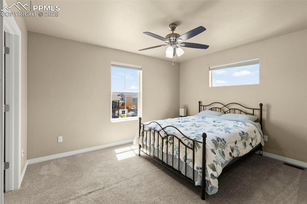 Image 27 of 27: Bedroom with carpet floors and ceiling fan