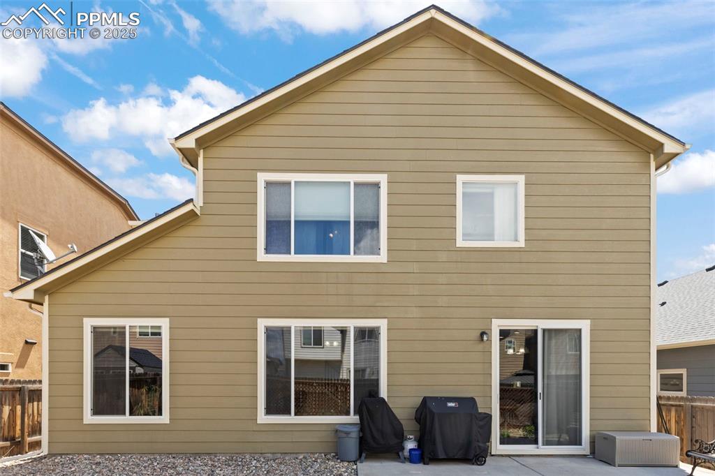 Image 3 of 27: Back of house featuring a patio area