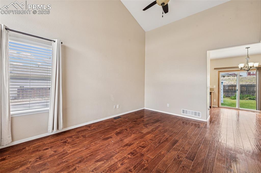 Image 4 of 39: Warm wood flooring in Living room, dining room & kitchen