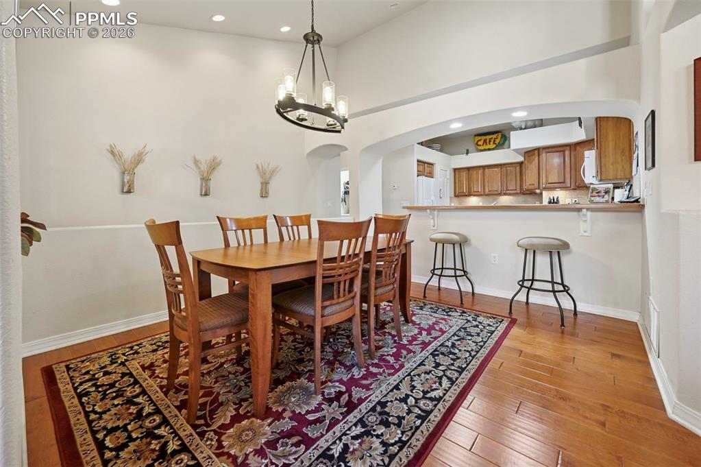 Image 15 of 45: Dining Room with wood floors