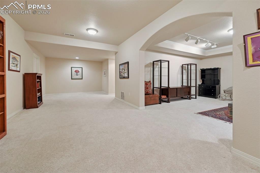 Image 25 of 45: Looking into the two living areas in the basement