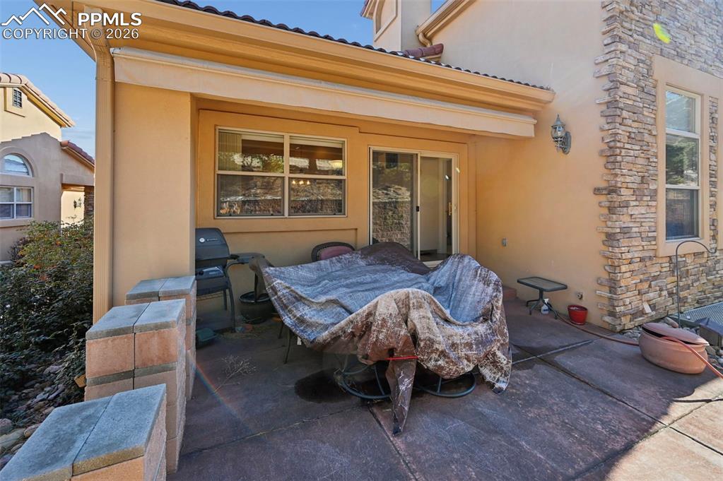 Image 35 of 45: Partially Covered Back Patio