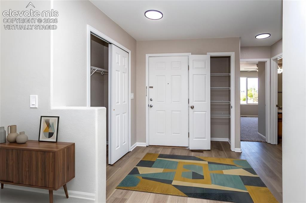Image 10 of 39: Virtually Staged Entrance Foyer - a welcoming space for family & friends!
