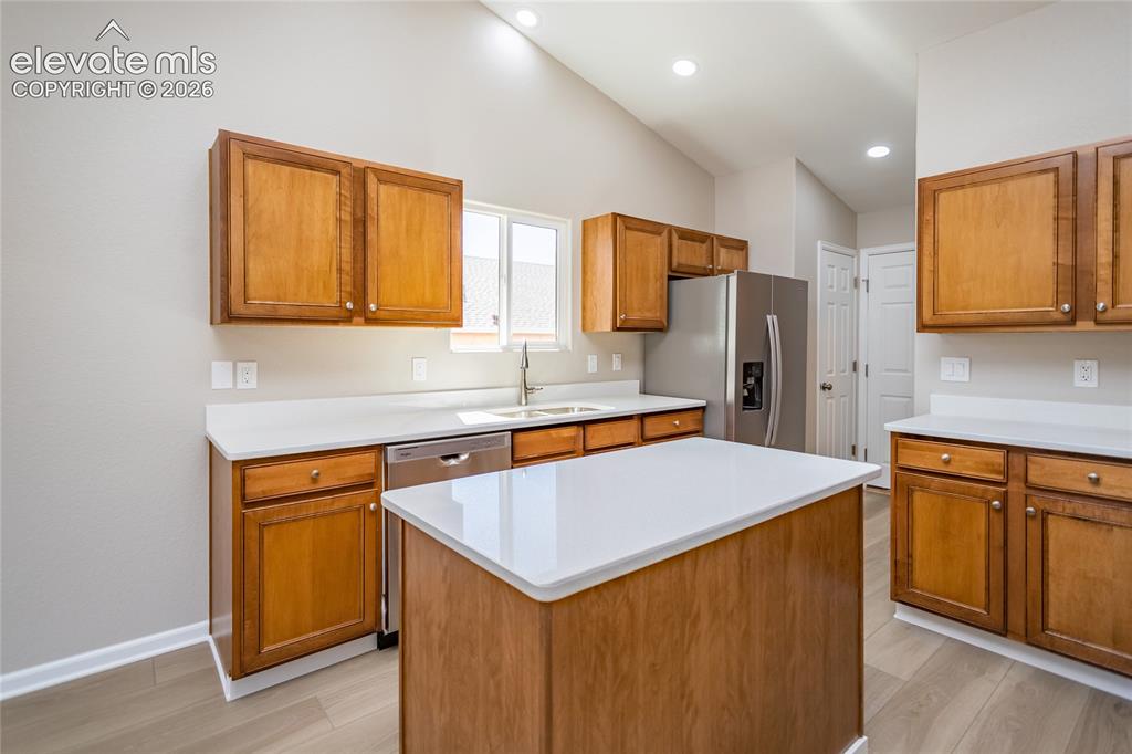 Image 19 of 39: Warm colored cabinets, new countertops!
