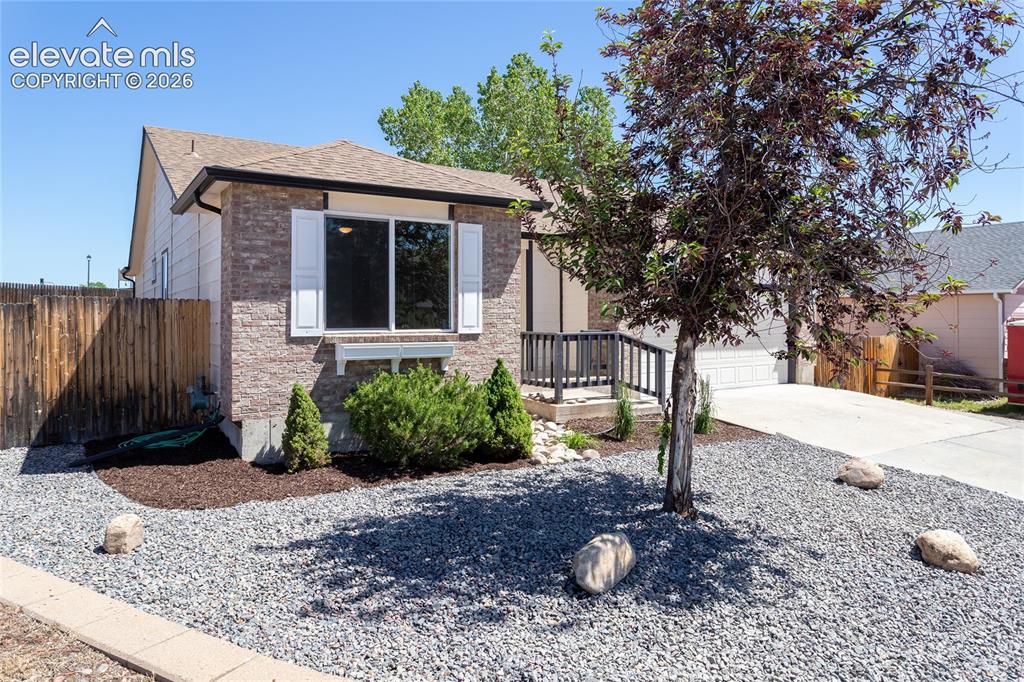 Image 2 of 39: Corner lot, easy maintenance landscaping, great curb appeal!