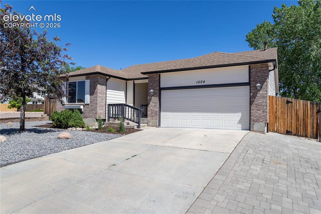 Image 4 of 39: Spacious 2 car finished garage & concrete driveway!