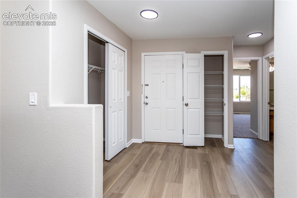 Image 9 of 39: New LVP, plenty of storage for jackets, bags & every day items!