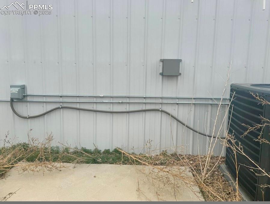 Image 3 of 5: Exterior view of a central AC unit