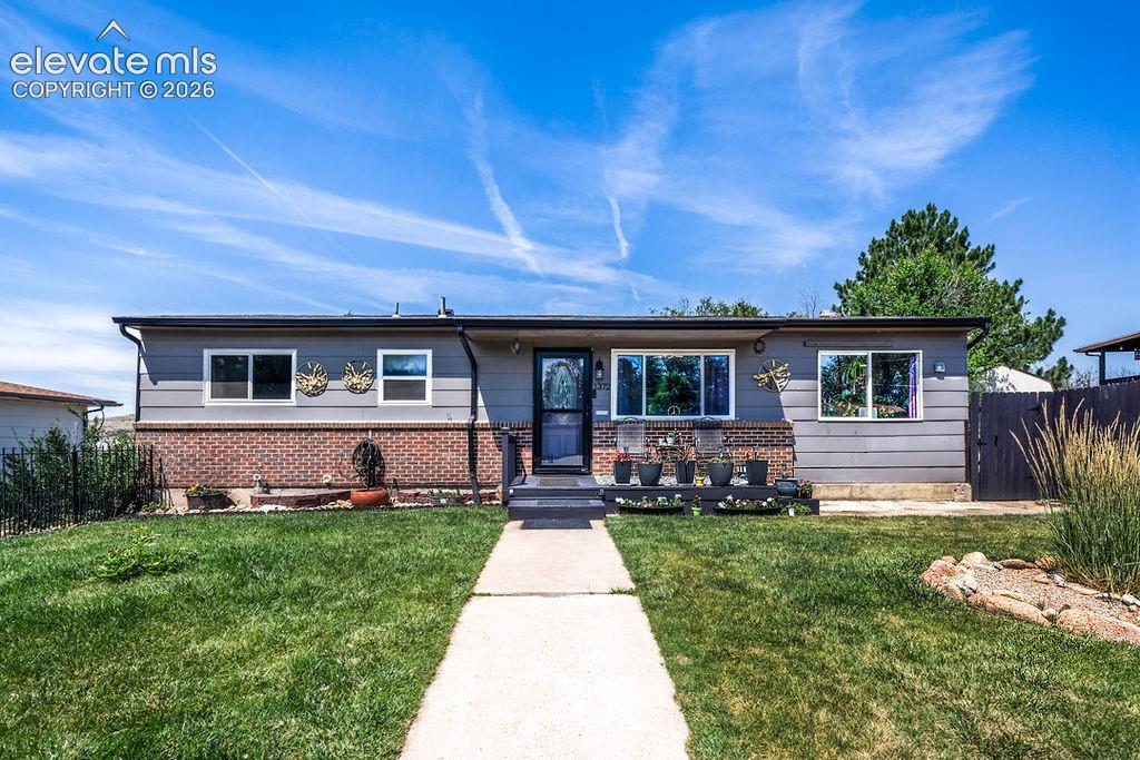 Image 1 of 44: Ranch-style residence featuring a combination of horizontal siding and bric