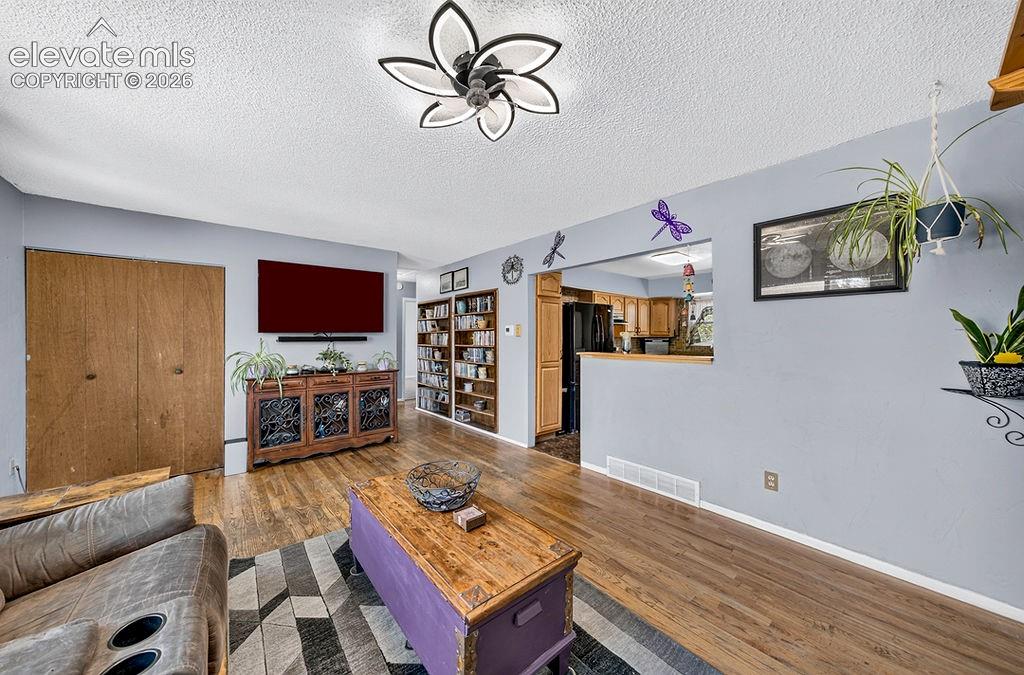 Image 15 of 44: Hardwood-finish flooring throughout