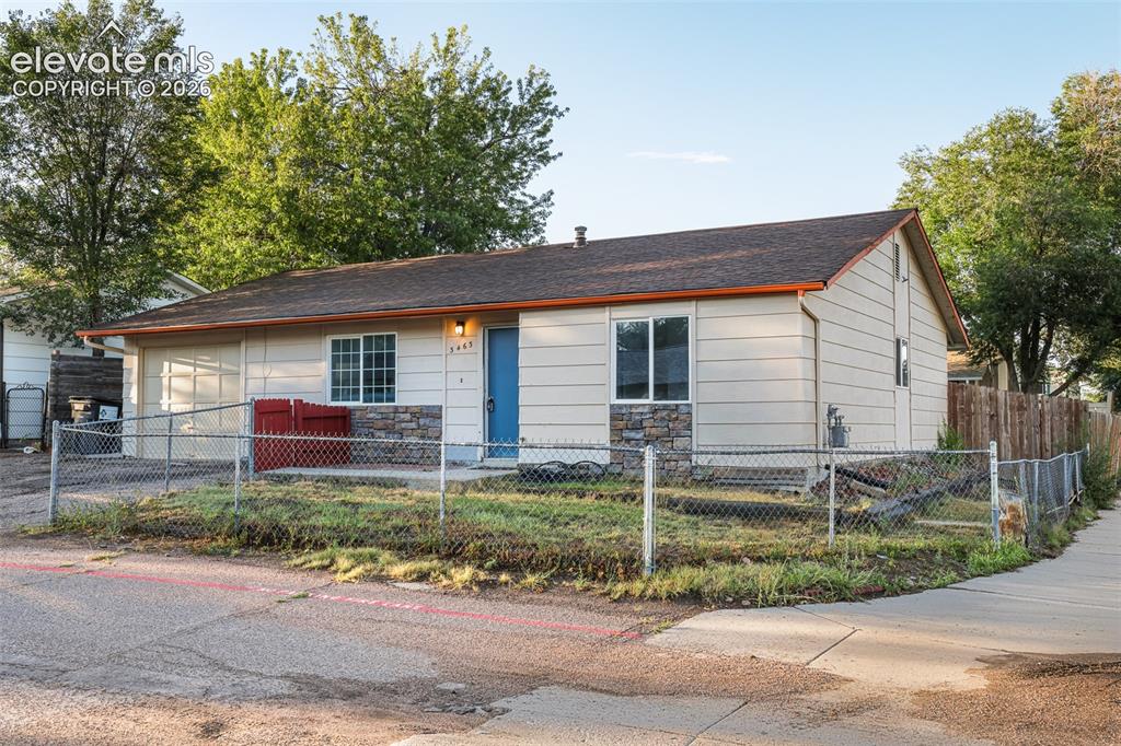 Caption: Charming single-story home featuring a gable roof with dimensional shingles, horizontal siding exter