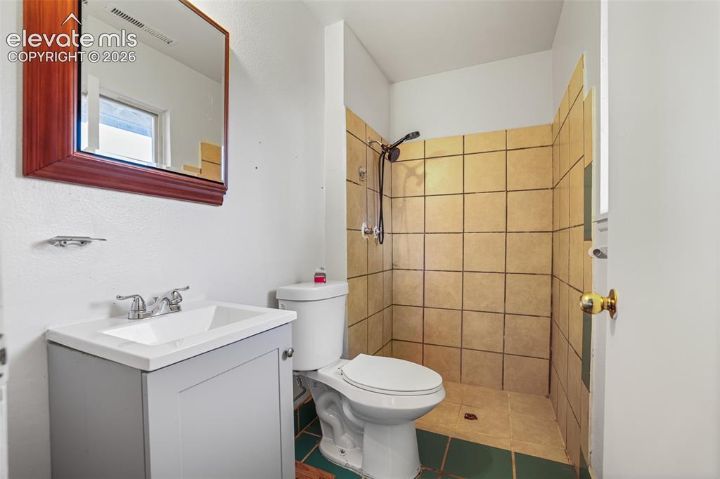 Image 15 of 19: Full bathroom featuring a pedestal sink with chrome faucet, white porcelain