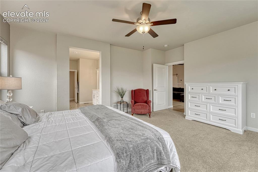 Image 19 of 41: Main level primary bedroom with...