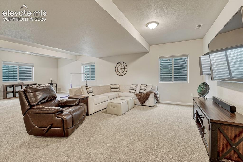 Image 27 of 41: Spacious family room. 