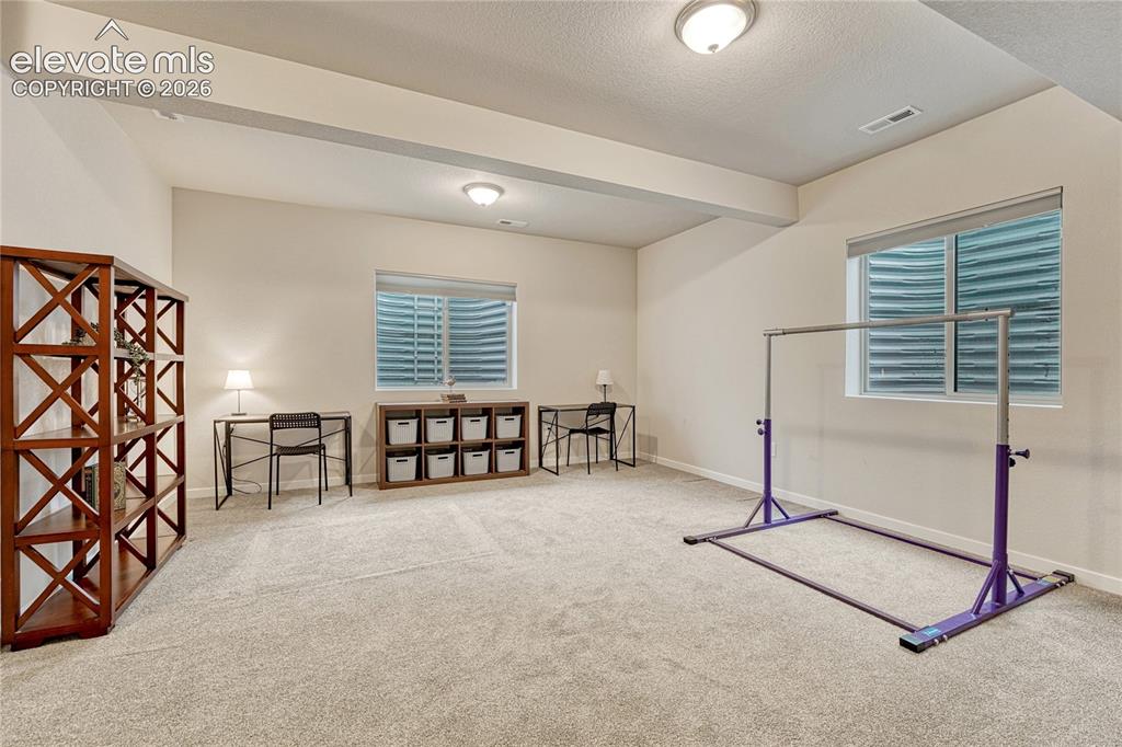 Image 30 of 41: Family room space offers lots of options...