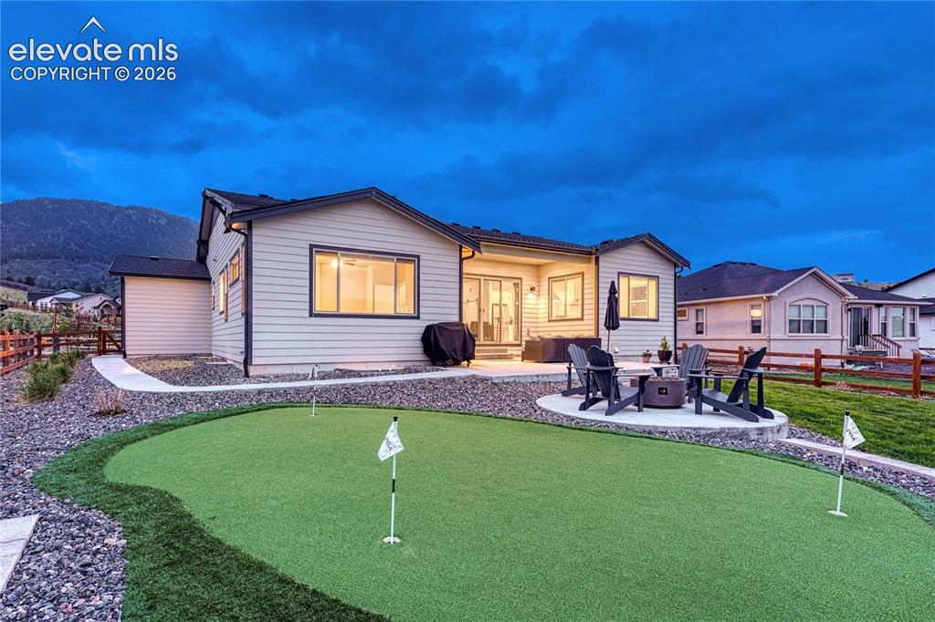 Image 9 of 41: ...backyard complete with two patios and a putting green.