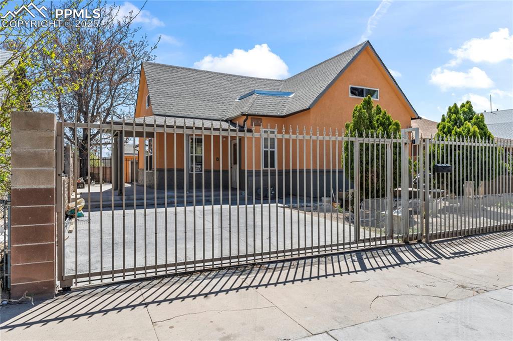 Image 2 of 36: View of gate with a fenced front yard