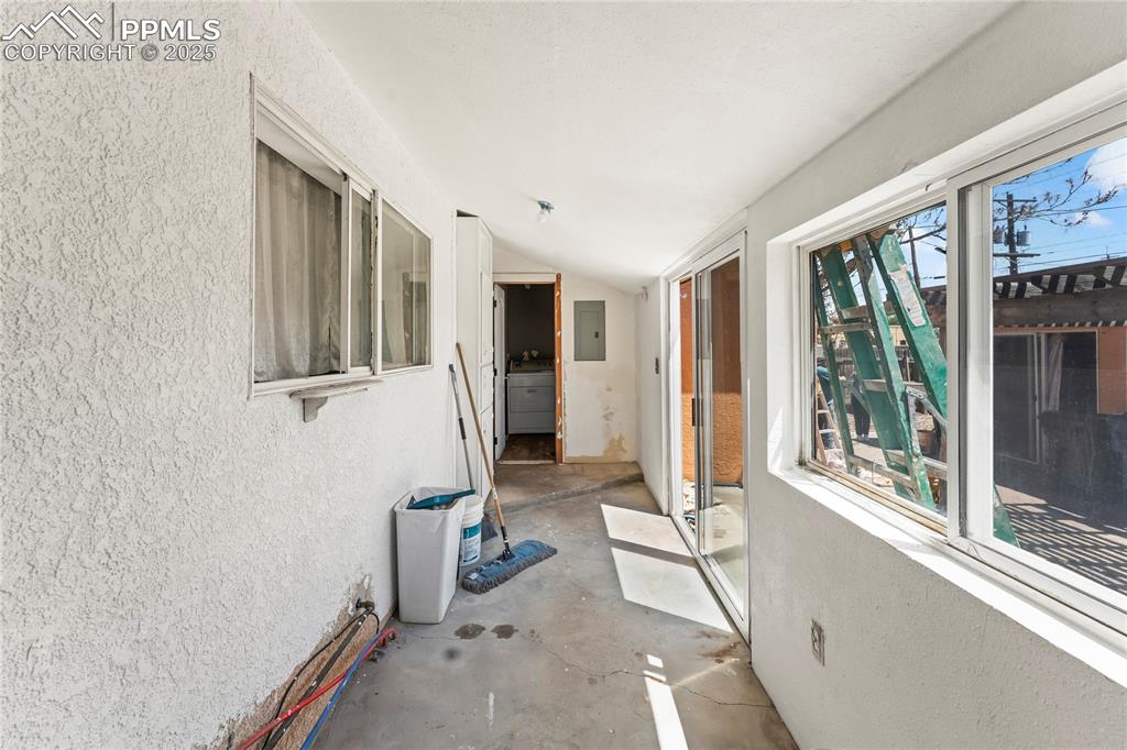 Image 23 of 36: Hall with washer / clothes dryer and electric panel