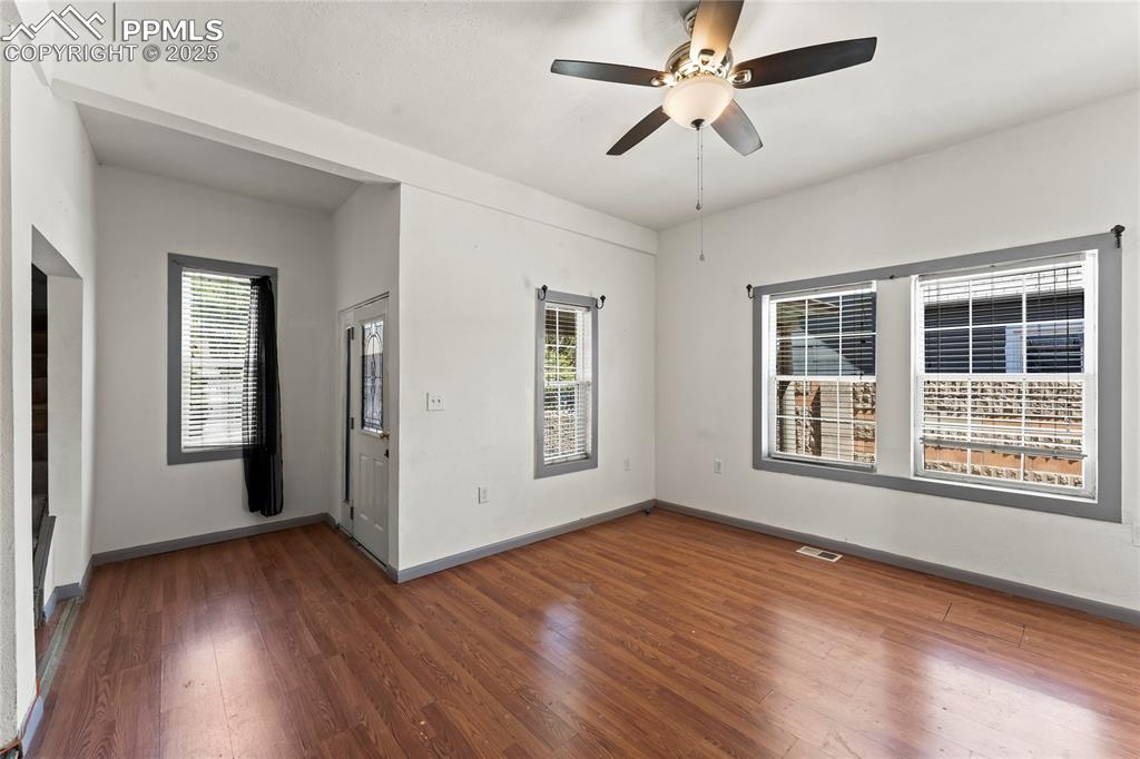 Image 4 of 36: Spare room featuring ceiling fan, visible vents, a healthy amount of sunlig