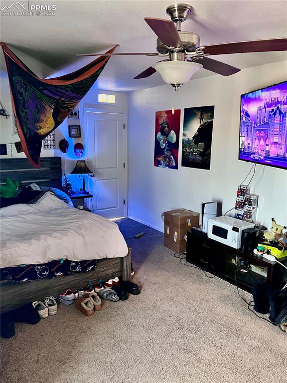 Image 10 of 17: Bedroom with ceiling fan and carpet