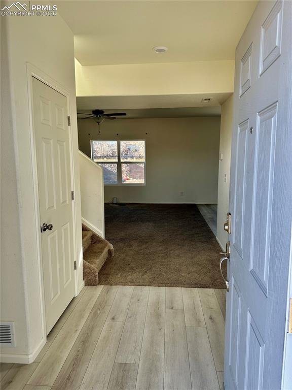 Image 4 of 17: Entryway featuring light wood finished floors and stairs