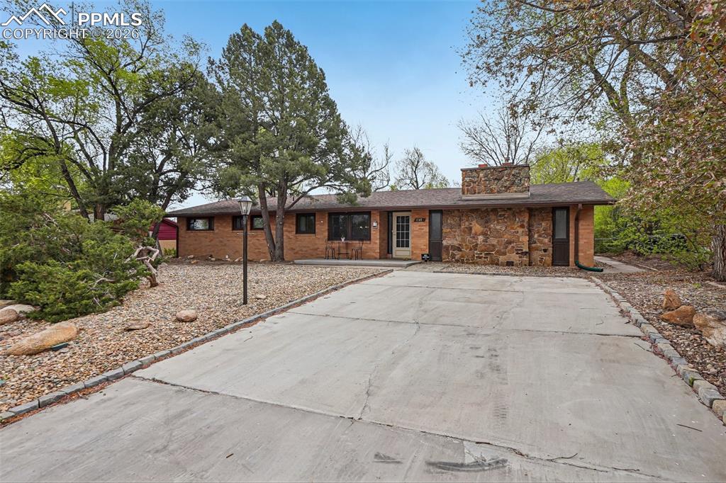 Image 2 of 38: Front yard is low maintenance.