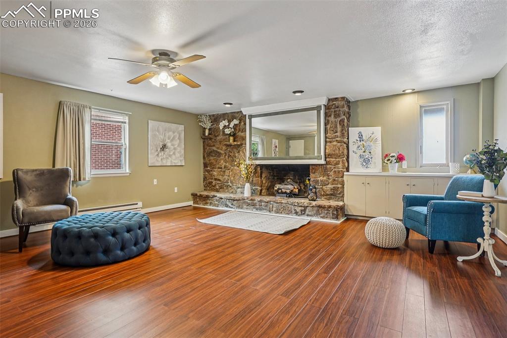 Image 6 of 38: This bonus family space with cozy fireplace would also make a luxurious off