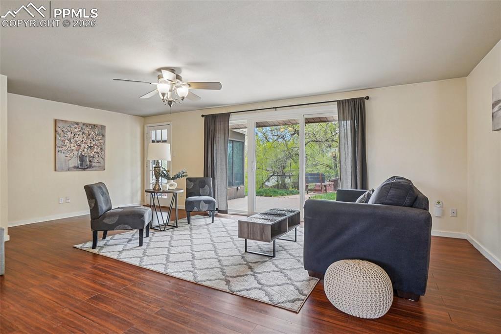 Image 9 of 38: The living room walks out to the backyard.