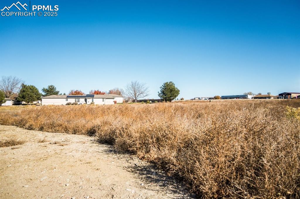 Image 7 of 8: View of yard with a rural view